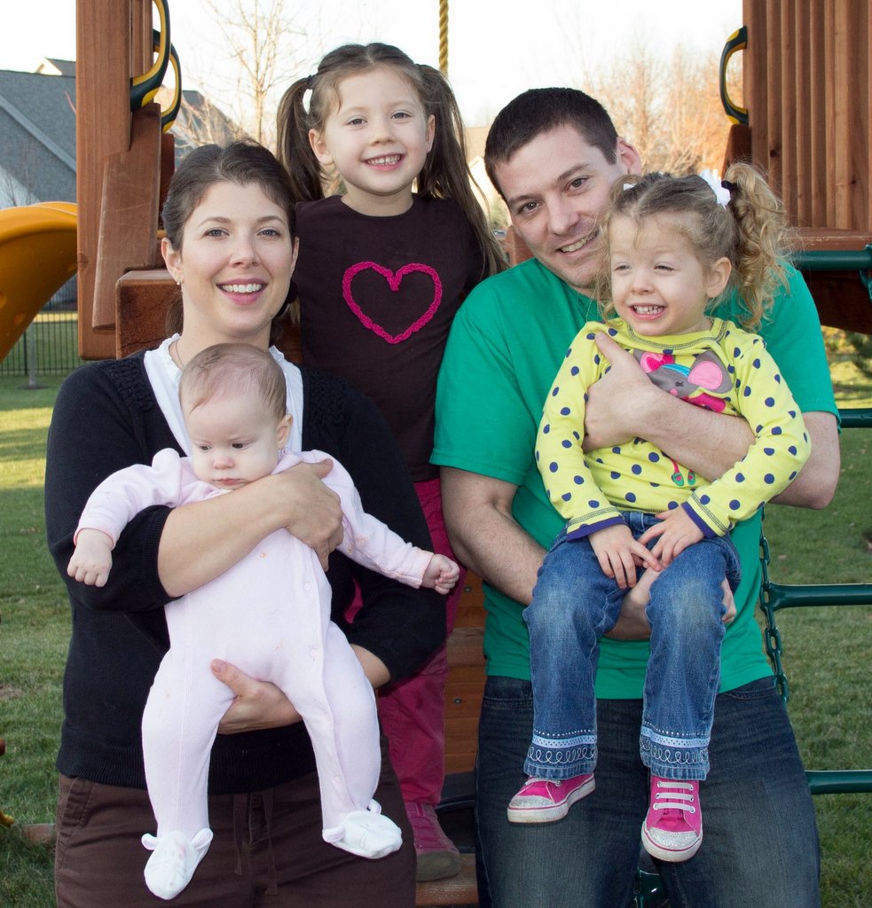 Robyn at the playground with her husband and children