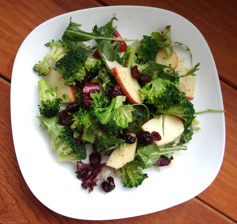 the salad served on a white plate