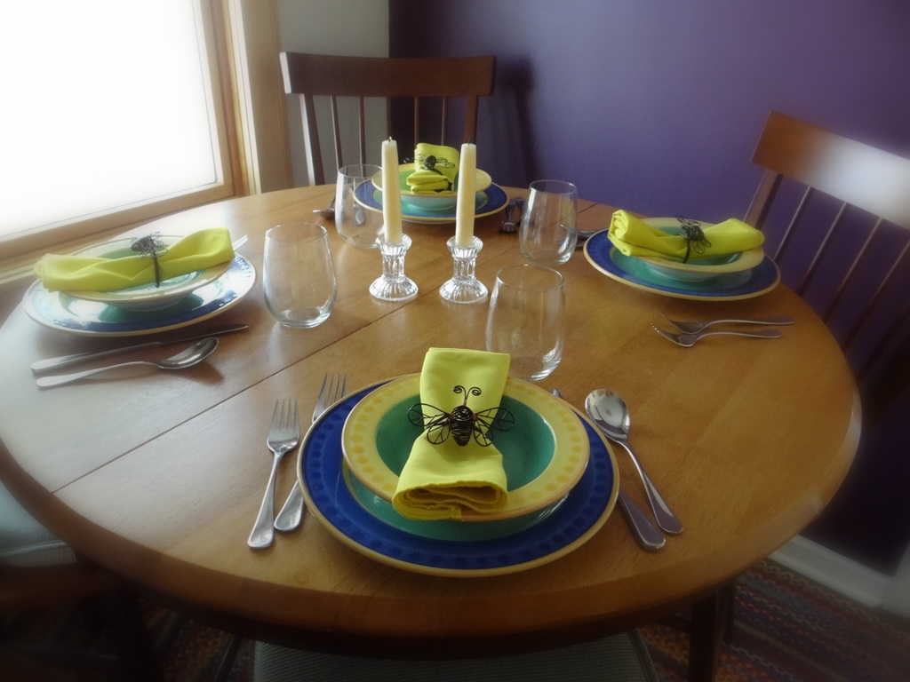 round kitchen table, set for dinner