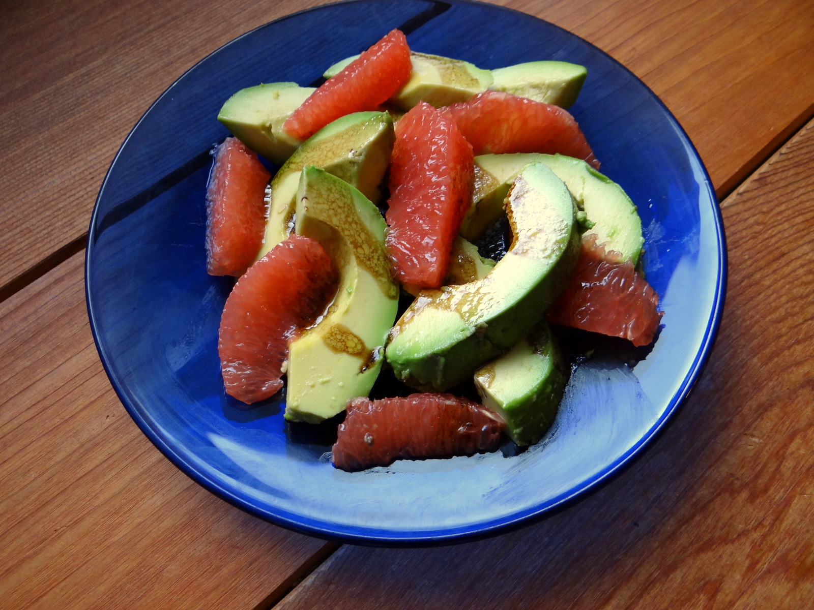 the salad served on a blue plate