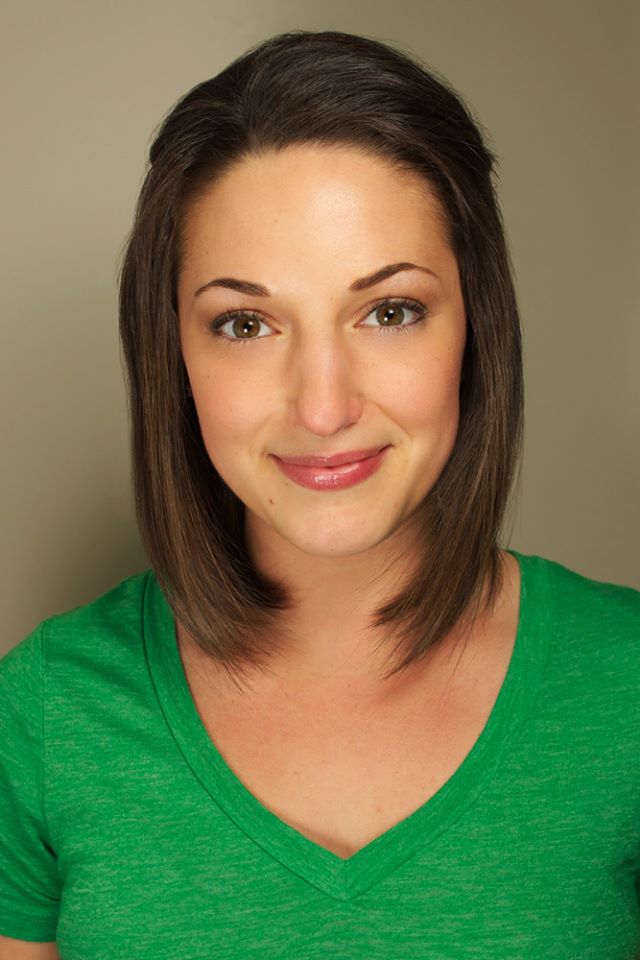 Headshot of Laura: brown hair, brown eyes, green shirt