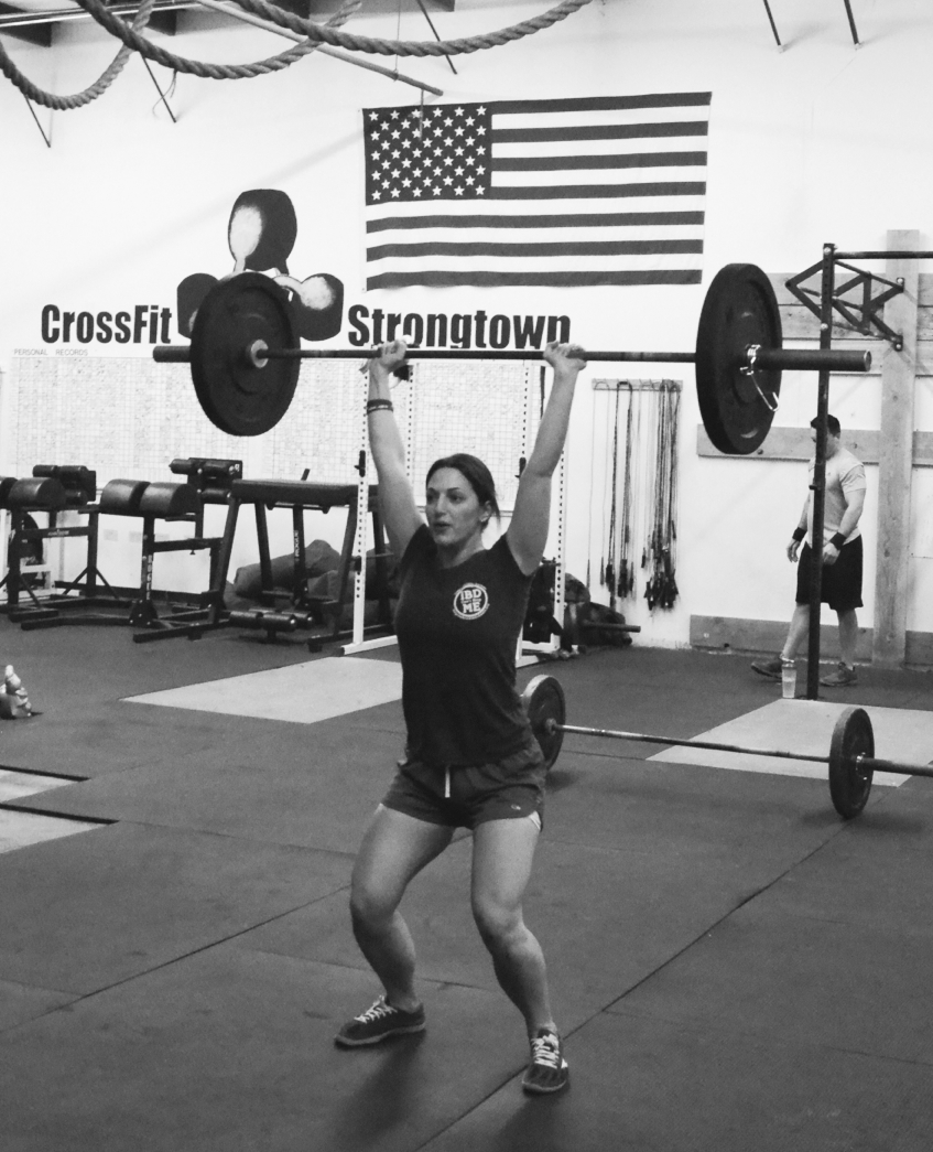 A photo of Laura lifting weights at CrossFit