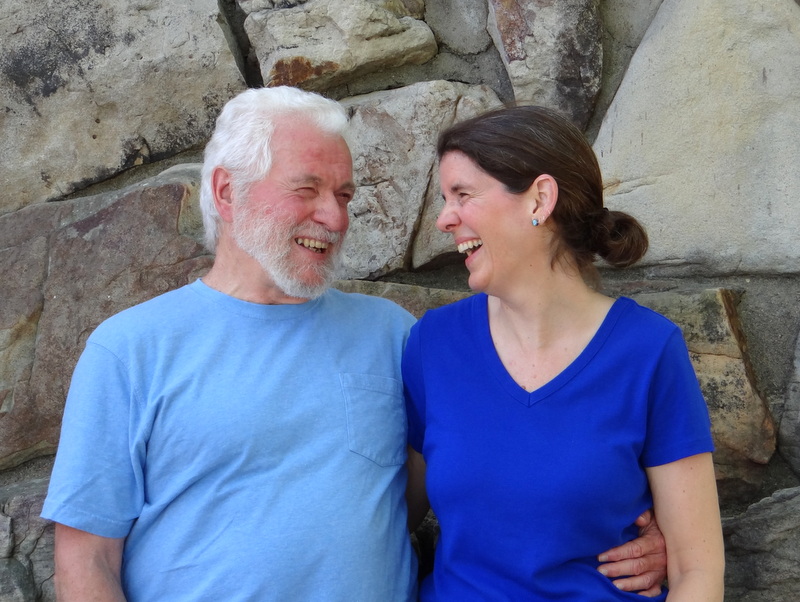 author and her husband, looking at each other and laughing