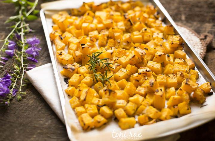 cubed squash on a cookie sheet