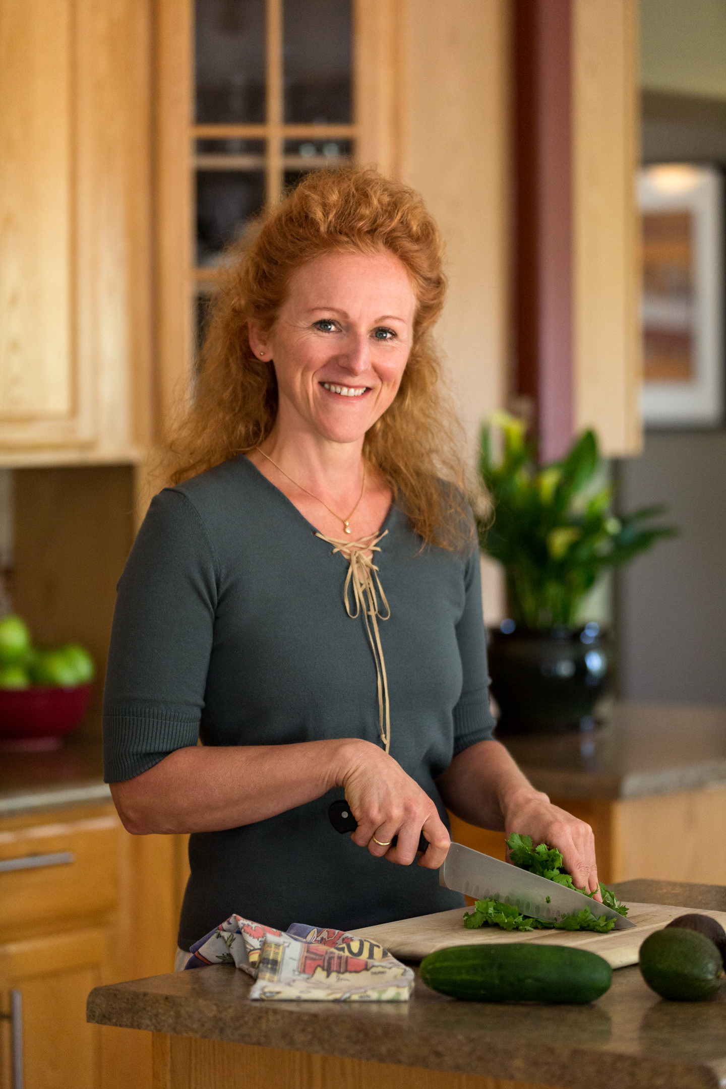 Sophie, chopping vegetables in her kitchen