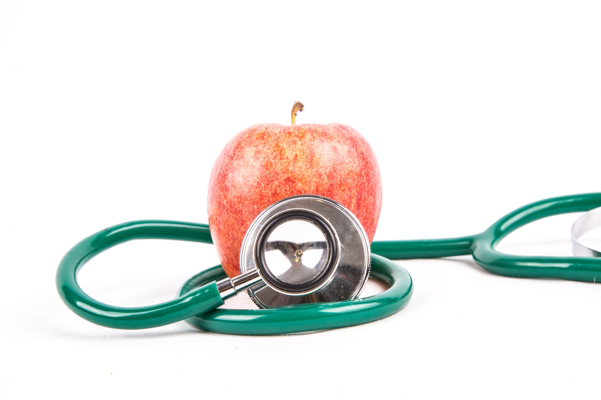 stethoscope wrapped around an apple