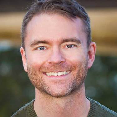 headshot photo of Robb, smiling