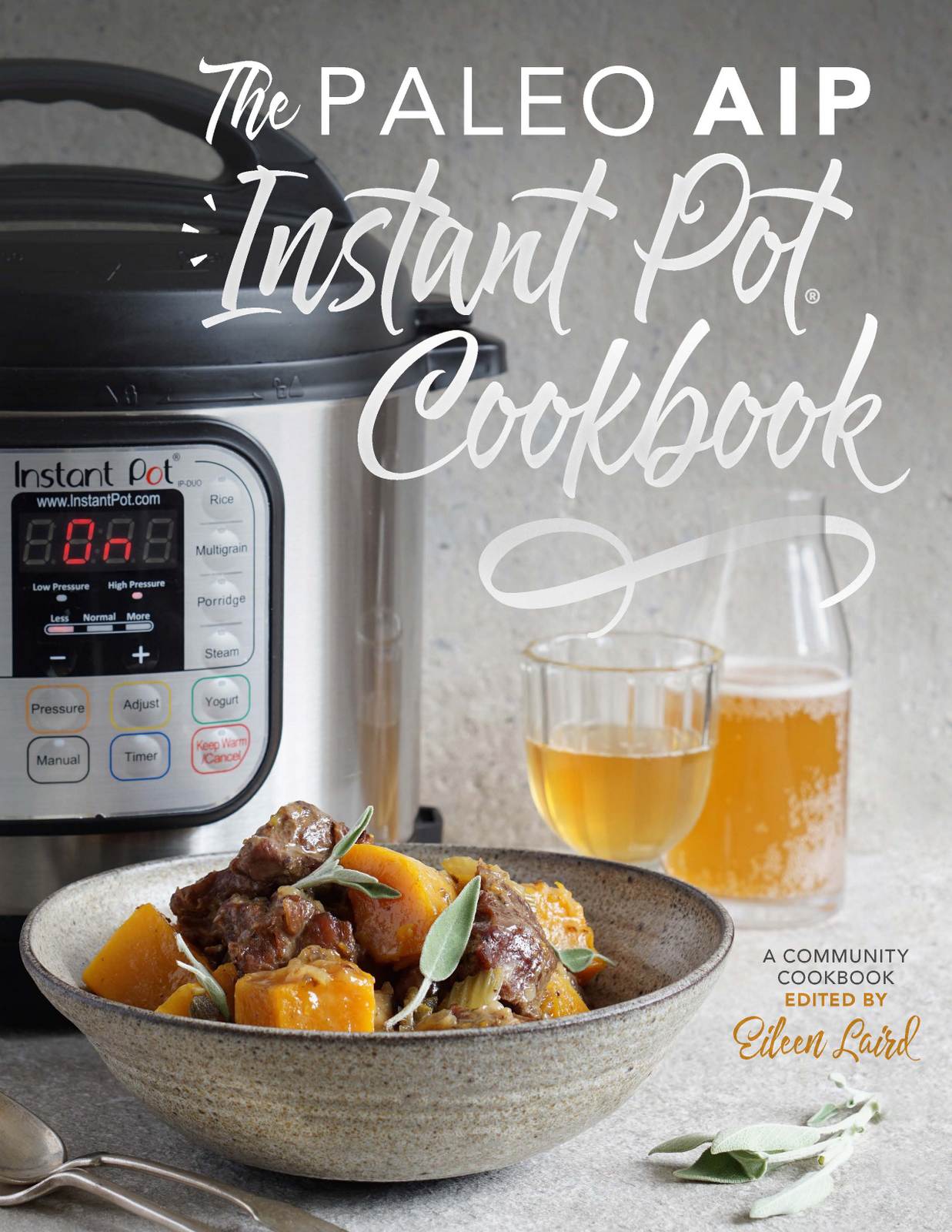 Cookbook cover showing the instant pot along with a bowl of lamb butternut stew