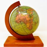 wooden globe on pedestal
