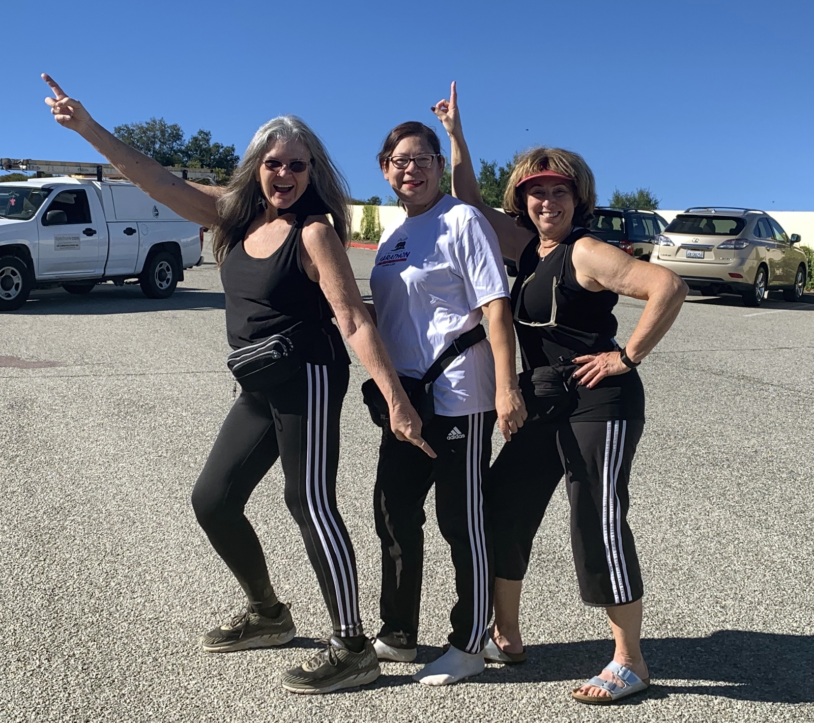 Debra striking a fun pose with two of her hiking friends