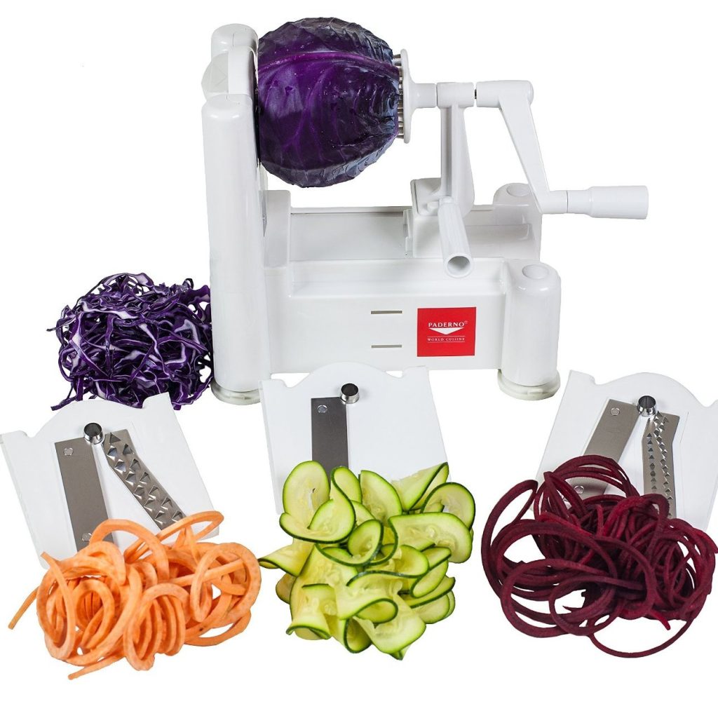 spiralizer tool surrounded by different spiralized vegetables