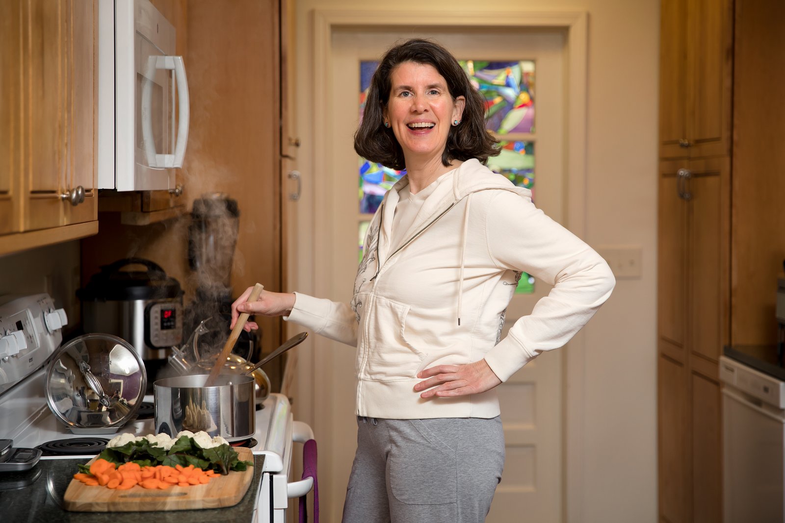 Eileen cooking in her kitchen