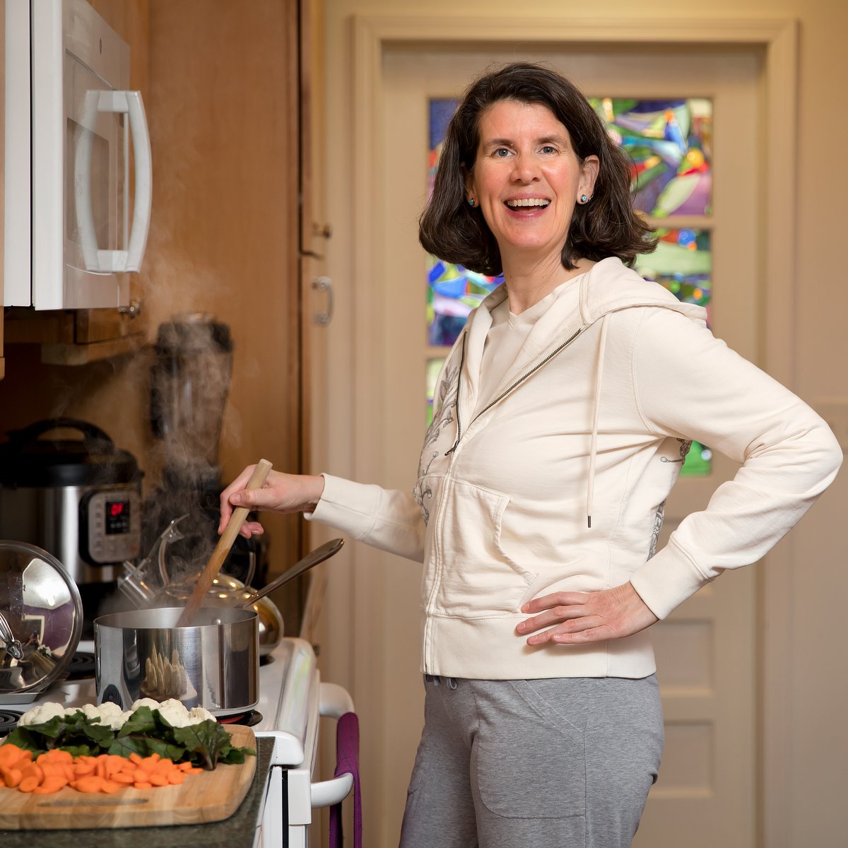 Eileen cooking in her kitchen