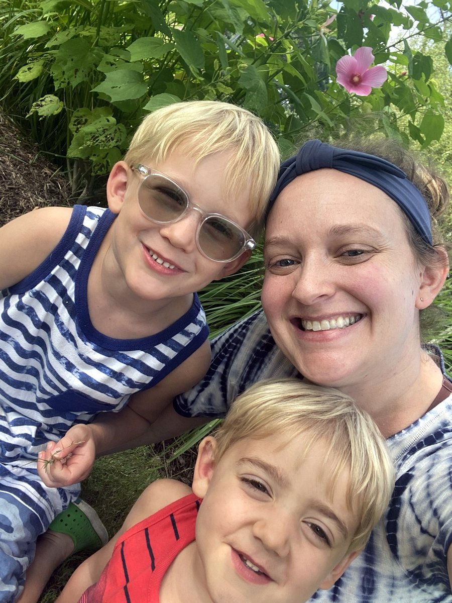 Lauren and her 2 young sons, snuggling and smiling