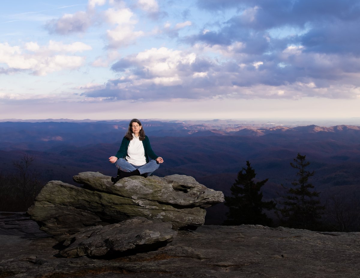 author meditating outside 