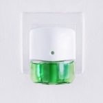 plugin air freshener with green liquid inside