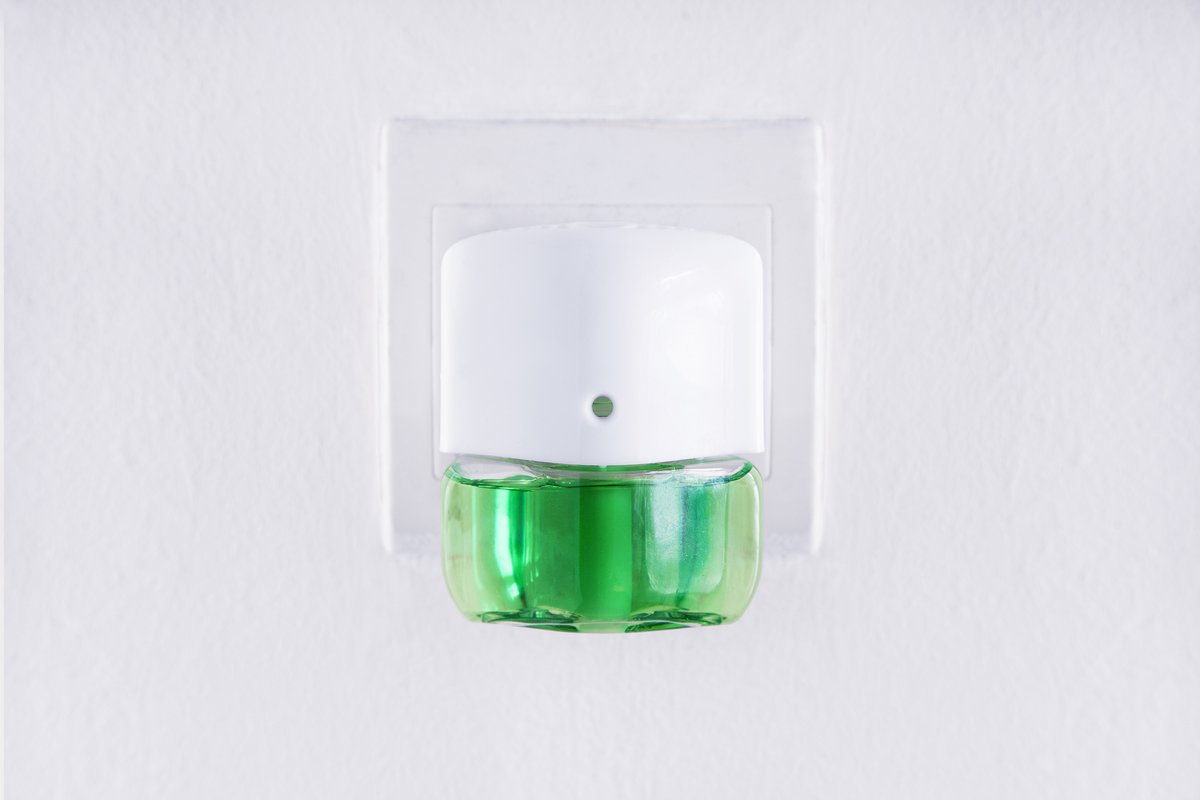 plugin air freshener with green liquid inside