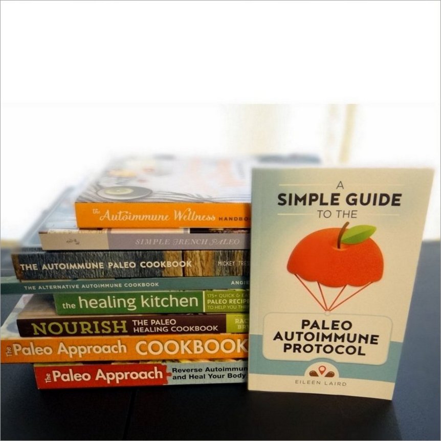 stack of paleo AIP books and cookbooks