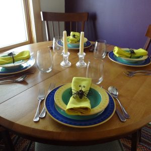 round kitchen table, set for dinner