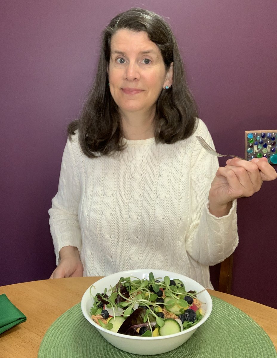 Eileen sitting at her kitchen table, a fork in her hand