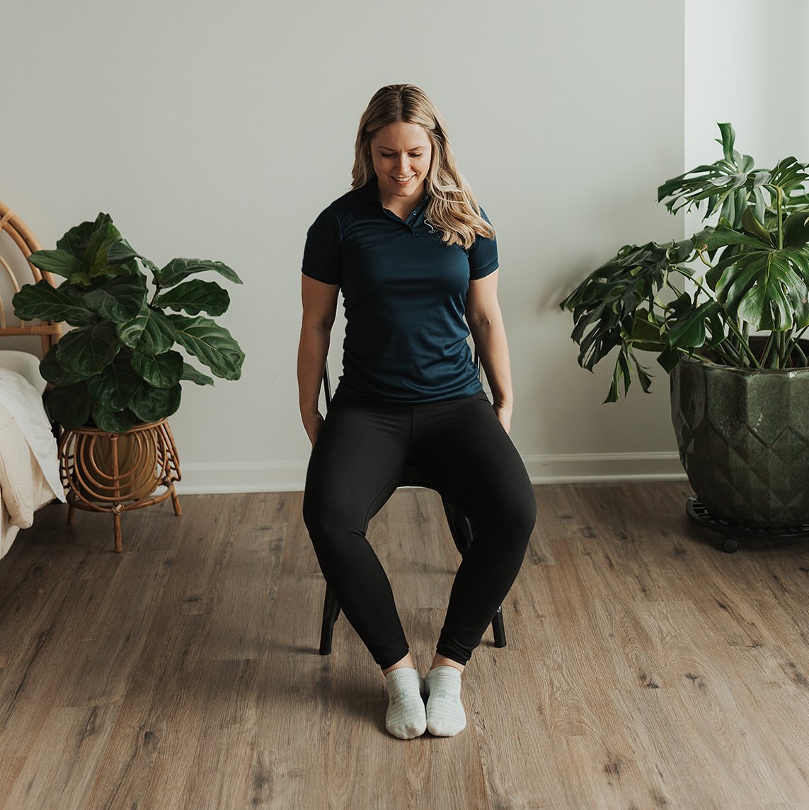 Gretchen demonstrating seated clamshell exercise