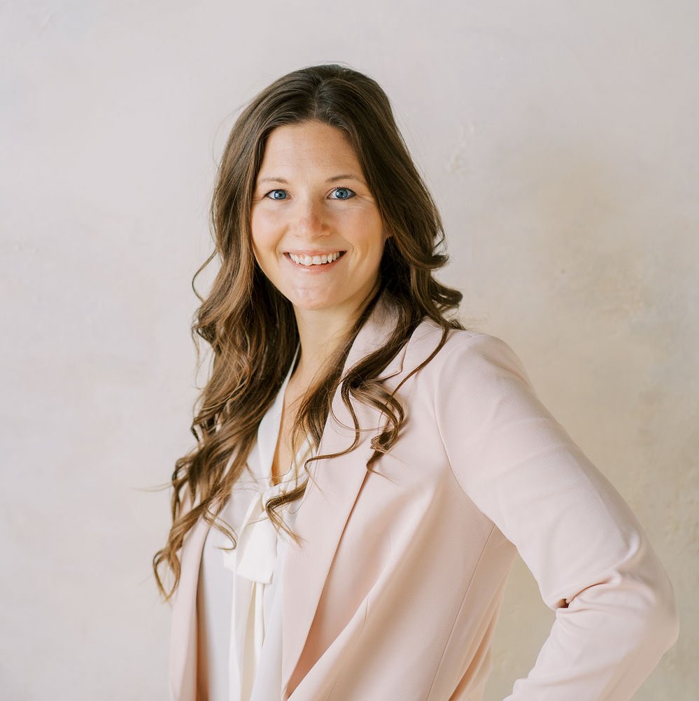 Jenna Cornell smiling with long brown hear 